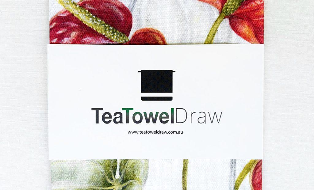 Bleached cardboard belly band. A Perfect way to showcase your brand and the tea towel design.